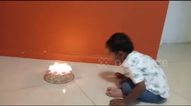 Birthday excitement...to cut the cake.he is so happy to cut his cake and to blow the candle.