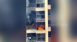 Electric car's battery catches fire when charging and burns balcony in China