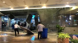 Shoppers flee as mall ceiling collapses under weight of rainfall in China