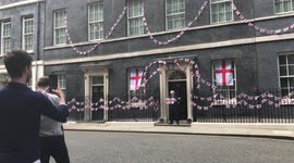 Match ready! Boris Johnson poses with St George flag outside 10 Downing Street ahead of Euro 2020 final