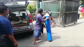 Long queues to fill oxygen tanks in Jakarta as Covid-19 spike drives shortages