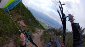 Daredevil speed-flyer skims treetops in breathtaking mountain decent