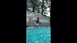 Guy completes amazing swan dive at the pool
