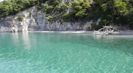 Nature's beauty. The shimmering waves of the sea that are clear and blue mirror the rays of the hot sun. The refreshing breeze that emanates from the seawaters is enjoyable. In conclusion, the beach has a perfect view and activities that are delightful to