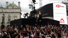 No Barrier to fun: England fans jump off boards protecting Shaftesbury Memorial in Piccadilly Circus