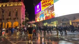 Italian and English fans separeted by police in Piccadilly Circus