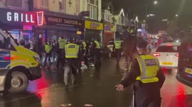 Moments of tension as England fan punches Italian supporter and runs away from police in Wembley, London