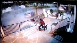Resting security guard shocked as car smashes into nearby fence in India