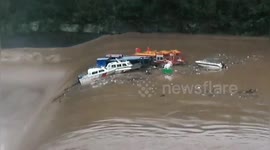 Flash floods wash away dozens of boats in southern China