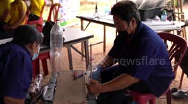 Struggling villagers recycle plastic bottles to make brooms