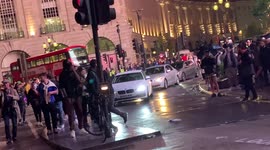 London: People hurl road traffic cones at each other after EURO 2020 final