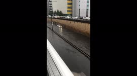 Rolls Royce driving through flood