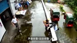 Quick-thinking grandmother saves granddaughter from falling off building in China