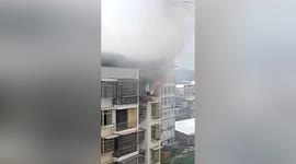 Chinese workers rescue boy trapped in burning flat on 7th floor of building