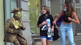 Practical joker dressed as statue scares public with funny prank