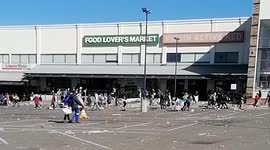 Shocking video shows crowd LOOTING shopping centre in Soweto as unrest grips South Africa
