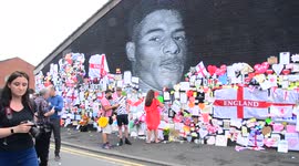 People leave hundreds of supportive notes on the giant Marcus Rashford mural Manchester, England, now fully repaired by street artist Akse.