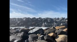Enormous Pacific Wave Crashes Over a Wall of Rocks in Morro Bay