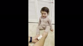Cute toddler refuses to let her dad give her mismatched shoes