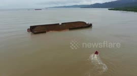 Huge barge carrying 6,000 tons of nickel partially capsizes off Indonesian coast