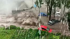 Cars swept away by flash floods due to heavy rainfall in northern China