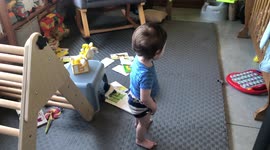 Baby Brother blows a kiss to his sister Ella the bengal cat