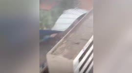 Powerful winds rip off building’s roof in central China