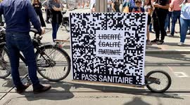 Protesters share message against Covid 19 resteictions thanks to his bike in Nantes, France