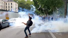 Protester launches tear gas back at police during rally against mandatory vaccines in Nantes, France
