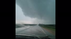 Tornado develops and crosses a road near Vinton, Iowa