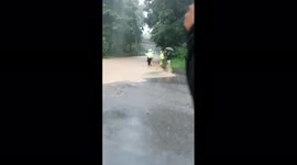 Flooded streets in Germany, water coming out of sewage, fire and police helping people