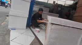 Indonesian coffin maker overwhelmed with orders as COVID-19 surge continues