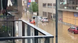Belgium flooding: Firemen getting off a rescue boat in Wavre, Belgium