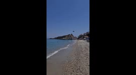 2nd day of wildfires in Samos, helicopters picking up water from the sea and dropping on the fires