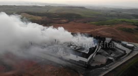 Aerial footage of warehouse destroyed by fire and looters in South Africa