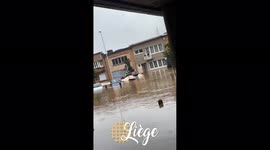 Man uses jet-ski to get around flooded streets of Liège, Belgium