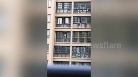 Boy spotted playing on edge of fourth-floor window in eastern China