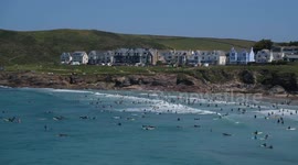Hundreds flock to beach in Cornwall as UK prepares for heatwave