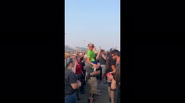 Humans helping humans a little guy wanted to jam out and another man was trying to help him I thought another man was coming to get them down but he helped him up