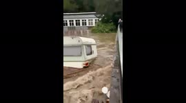 Caravan floats down river then smashes into pieces against bridge in Swiss floods