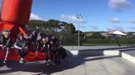Swinging on the Stratosfear at Rainbows End theme park in Manukau, Auckland