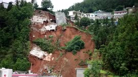Houses collapse as dramatic landslide hits southern China