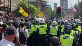 Police scuffle with anti-vaccination protesters at the Freedom Day demonstration in London