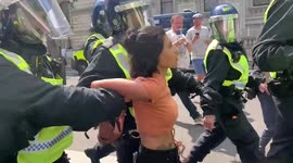 16a. Freedom Day: Young woman escorted by 7 police officers after anti-lockdown protest