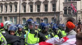 11. Police scuffle with protestors at London anti-lockdown rally