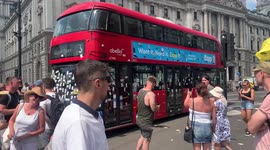 6. Bus covered in anti-lockdown stickers is removed from anti-lockdown rally