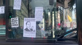 5. A London bus is covered in anti-lockdown stickers during anti-lockdown rally