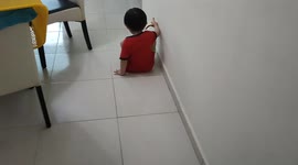 Hilarious toddler crawling on floor as its wet after mopping by his dad
