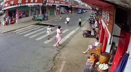 Residents cower inside shops to avoid debris blown by gale winds in southern China