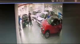 Driver crashes brand new car in dealer showroom, pummels from first floor ramp